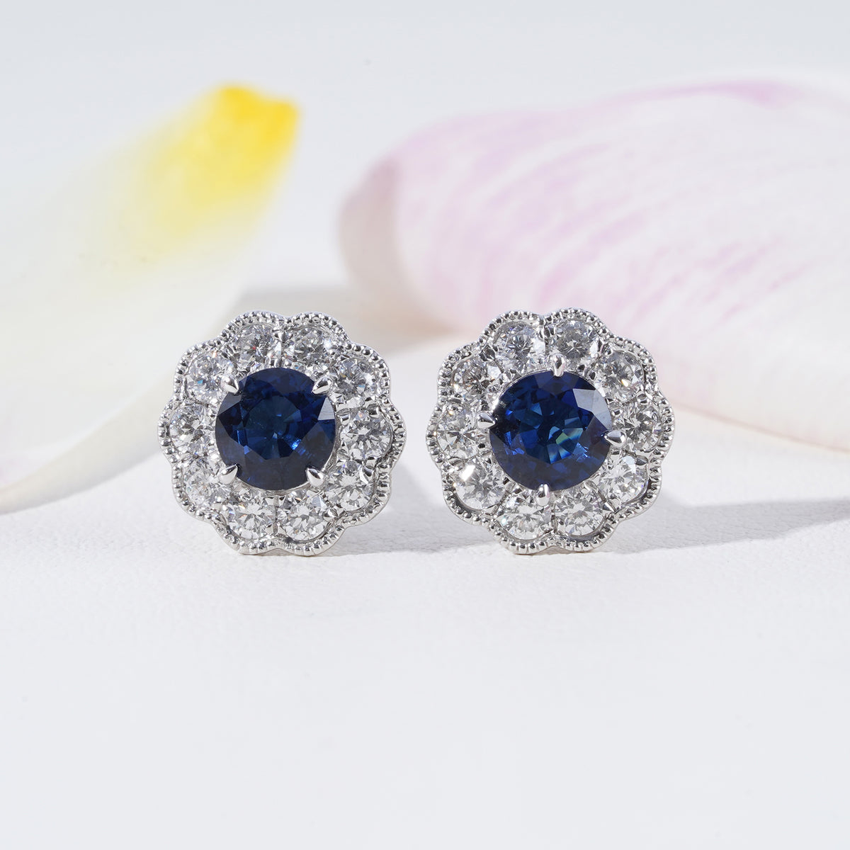 Blue Sapphire & Diamond Halo Earrings in 18K White Gold