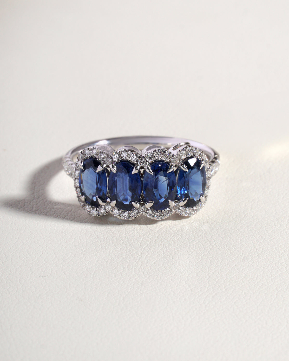 Naya Blue Natural Sapphire & Natural Diamond 5 Stone Eternity Band with Halo in 18K White Gold